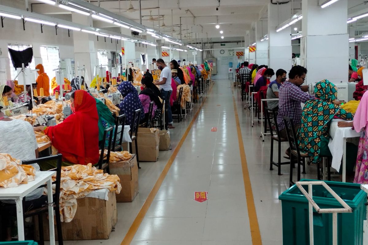 Production floor at Platinum Apparel, operators working along the sewing lines