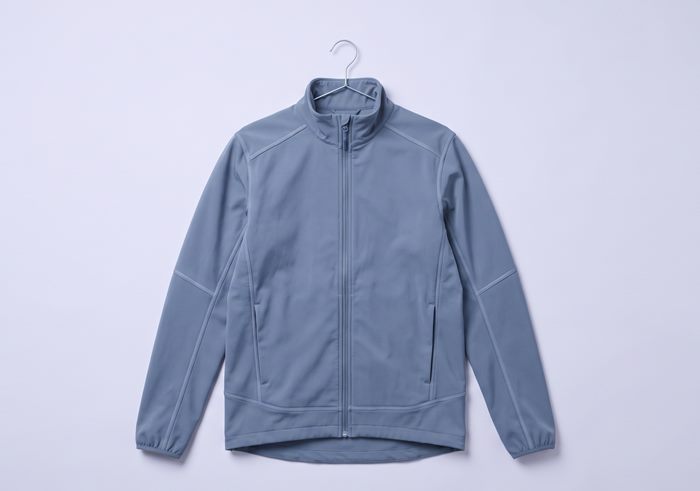 Slate blue softshell jacket on a slim hanger showing zip and seam detail